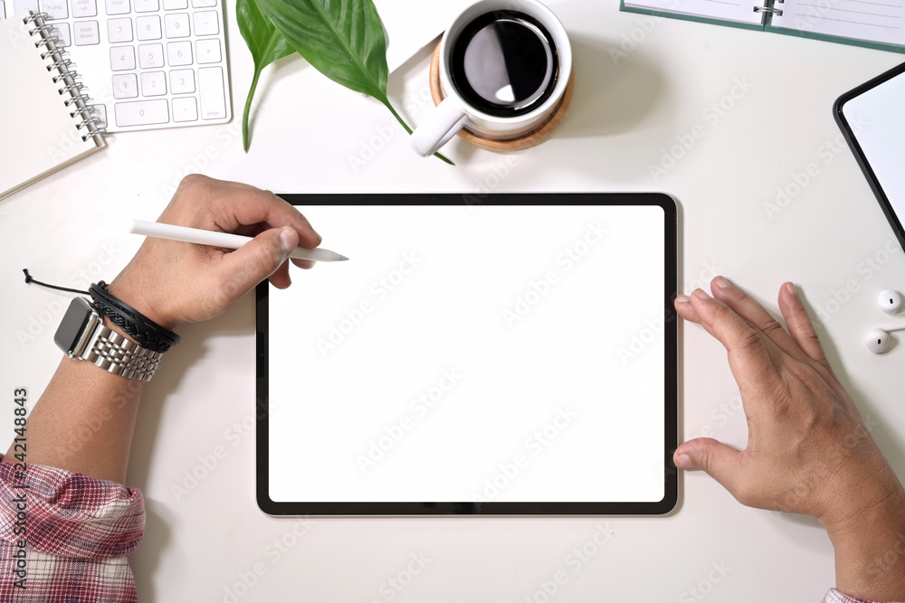 Fototapete top view man kind drawing and working with digital display graphics tablet touchscreen on home works