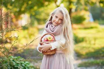 Happy little child, baby girl playing in autumn on nature walk outdoors. Autumn background. Family walk in park. School time. childhood happiness. Fall season. 