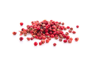 dried pink peppers isolated on white background