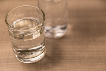 Glass of drinking water on wood table