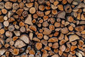 pile of stacked chopped woods for heating