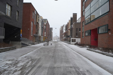 Street on the background of red houses