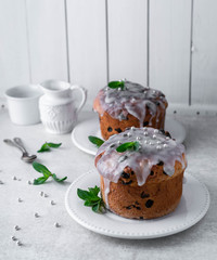 Easter cake on a white plate, light composition, white wooden background