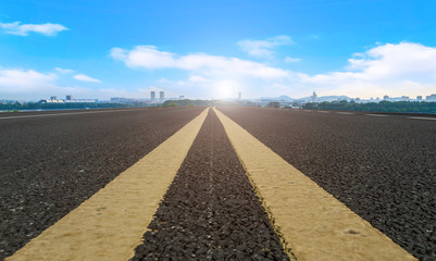 Empty asphalt road square and natural landscape under the blue sky