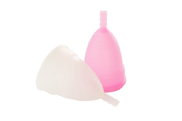 Pink and white menstrual cups isolated on white background.