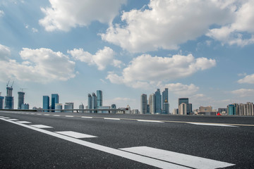 Empty asphalt road along modern commercial buildings in China,s cities