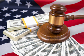 Judge's gavel and dollars money against the background of the flag of America. US, Business concept idea, finance, budget, capital. hammer of justice