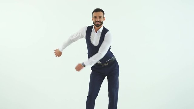 The businessman dancing on the white background