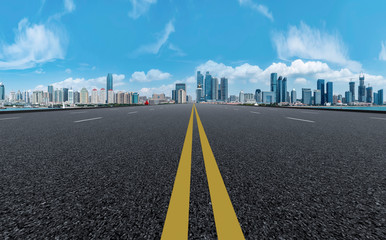 Empty asphalt road along modern commercial buildings in China,s cities