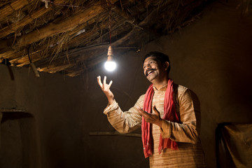 Rural Indian man delighted on electricity reaching her home