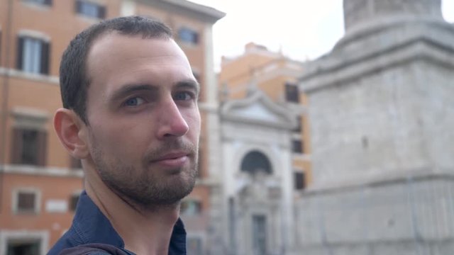 Trendy Young Man Taking Sunglasses Off. In Fashionable Old European City.