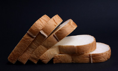 Soft bread with a black background.