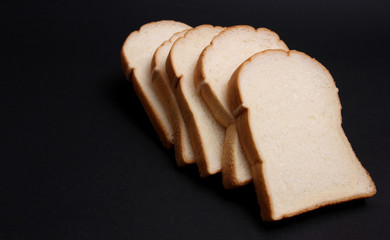 Bread and black background.
