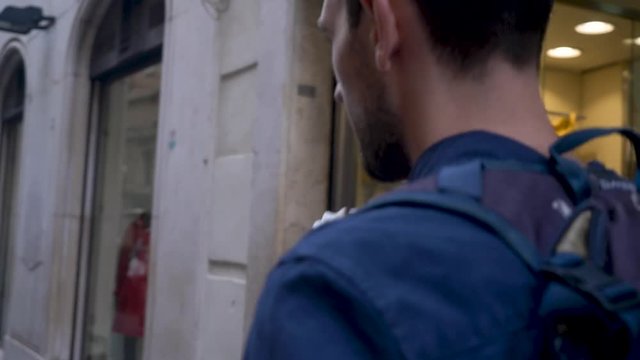Following Male Tourist In Narrow Street Eating Ice Cream.