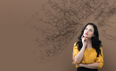 Confused concept with young businesswoman in a thoughtful face