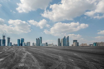 Fototapeta premium Empty asphalt road along modern commercial buildings in China,s cities