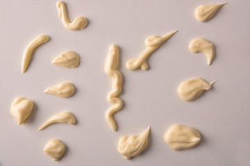 Set of mayonnaise splashes on white table top view