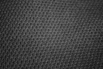 Close up gray cotton fabric texture background. Black textured knit. Selective focus.top view.