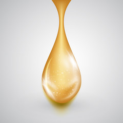 Oozing drop of golden oil with shiny winds. Precious liquid skin care emulsion, symbol of organic nutrition, natural make up components, healthy cooking, ecological production, isolated on white.