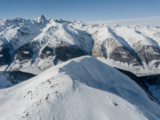 Aerial view of snow covered mountain peak in swiss alps