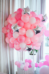Decorations for holiday party. Pink and white balloons at the birthday