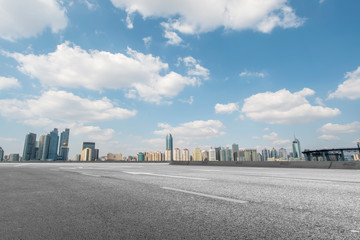 Empty asphalt road along modern commercial buildings in China,s cities