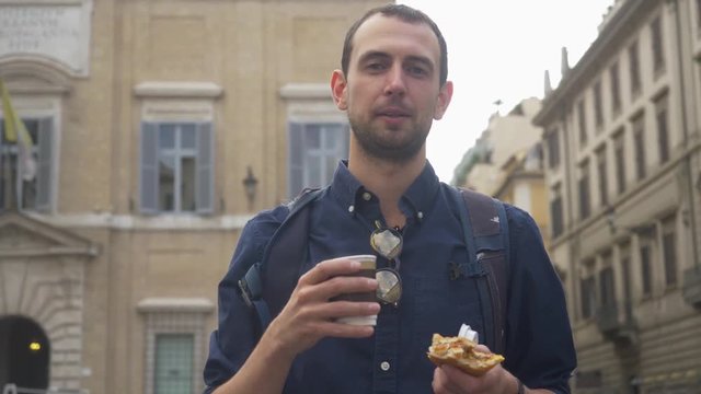 Authentic Young Backpacker Drinking Takeaway Coffee In An Old Town.
