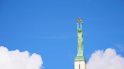 Famous landscape view of statue The Freedom Monument in Latvia Riga old town © BabyQ