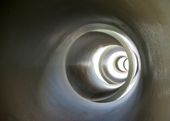 A series of tubes or pipes leading into the distance