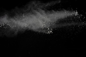 Fototapeta na wymiar White powder explosion isolated on black background.