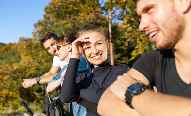 Group of friends on tourist trip looking at landscape