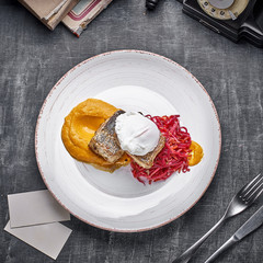 roasted Pike perch with vegetable noodles and egg. Close up, selective focus. Dietary menu. Fish menu. Seafood. Concept of healthy food.