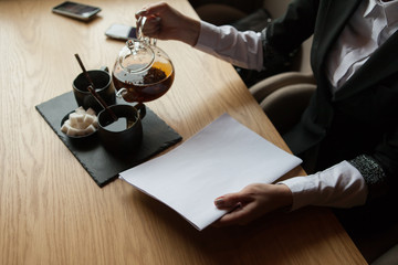 the girl holds in hand the magazine model the A4 format