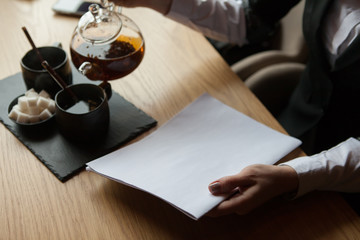 the girl holds in hand the magazine model the A4 format