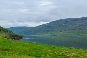 Naklejka na ściany i meble Coastline and landscape along the Isafjordur fjord
