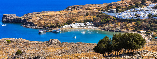 Naklejka premium LINDOS,RHODES/GREECE OCTOBER 3 2018 :THE bay of lindos.photo taken from the hill before the village entrance