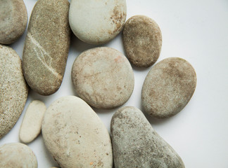 Fototapeta na wymiar sea round stones, pebbles on white isolated background