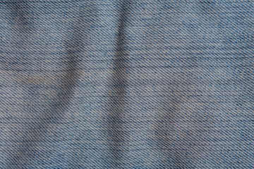 Texture of worn blue jeans for background