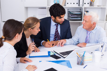 Office workers are writing financial reports