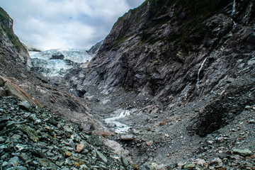 New Zealand tourist popular attractions/destinations concept. Scenic landscape view of valley and Franz Josef Glacier in summer season, located at West Coast, South Island. 