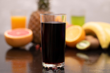 pomegranate juice into glass, closeup