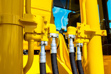 Close up of pipe system of hydraulic valves in agricultural machinery