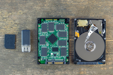 Memory evolution concept. Flat lay still life of hard drive, flash drive and usb flash stick with...