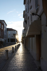 Fototapeta na wymiar Nicole Matafara Historic street in Zadar Croatia. To the Cathedral Tower.