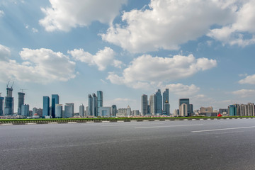 Fototapeta premium Empty asphalt road along modern commercial buildings in China,s cities