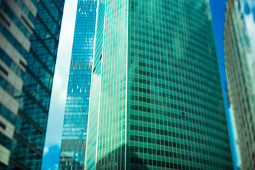 Abstract fragment of contemporary architecture, walls made of glass and concrete. Glass curtain wall of modern office building