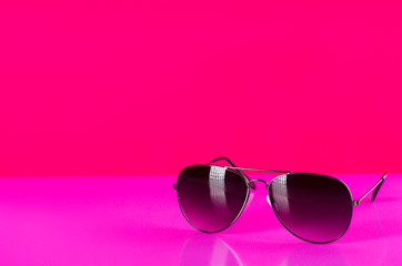 Sunglasses fashion summer accessory on pink background