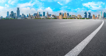 Obraz premium Empty asphalt road along modern commercial buildings in China,s cities