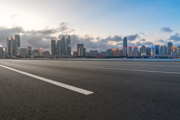 Obraz premium Empty asphalt road along modern commercial buildings in China,s cities