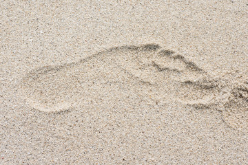 footprint on sand of the beach